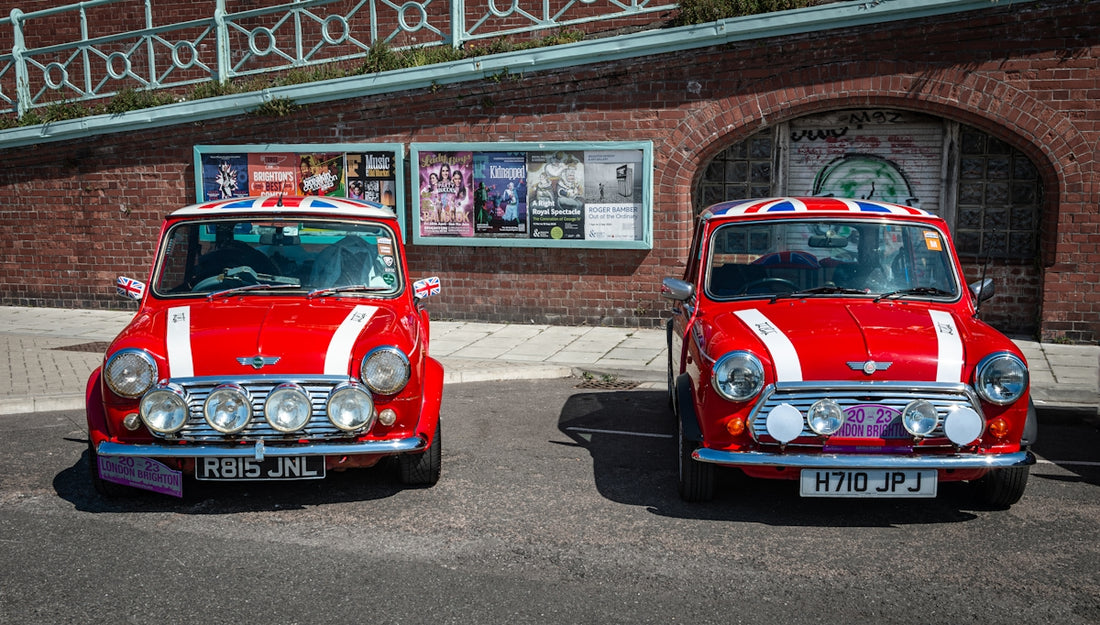 a couple of red and white cars parked next to each other