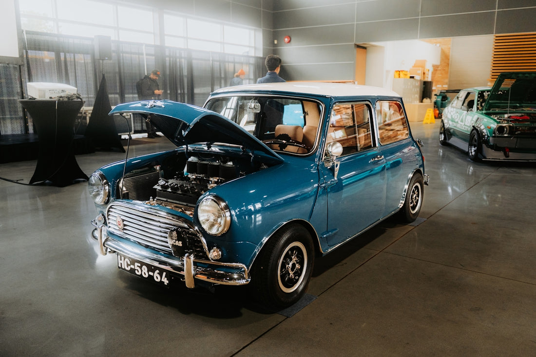 A blue classic mini cooper on display.