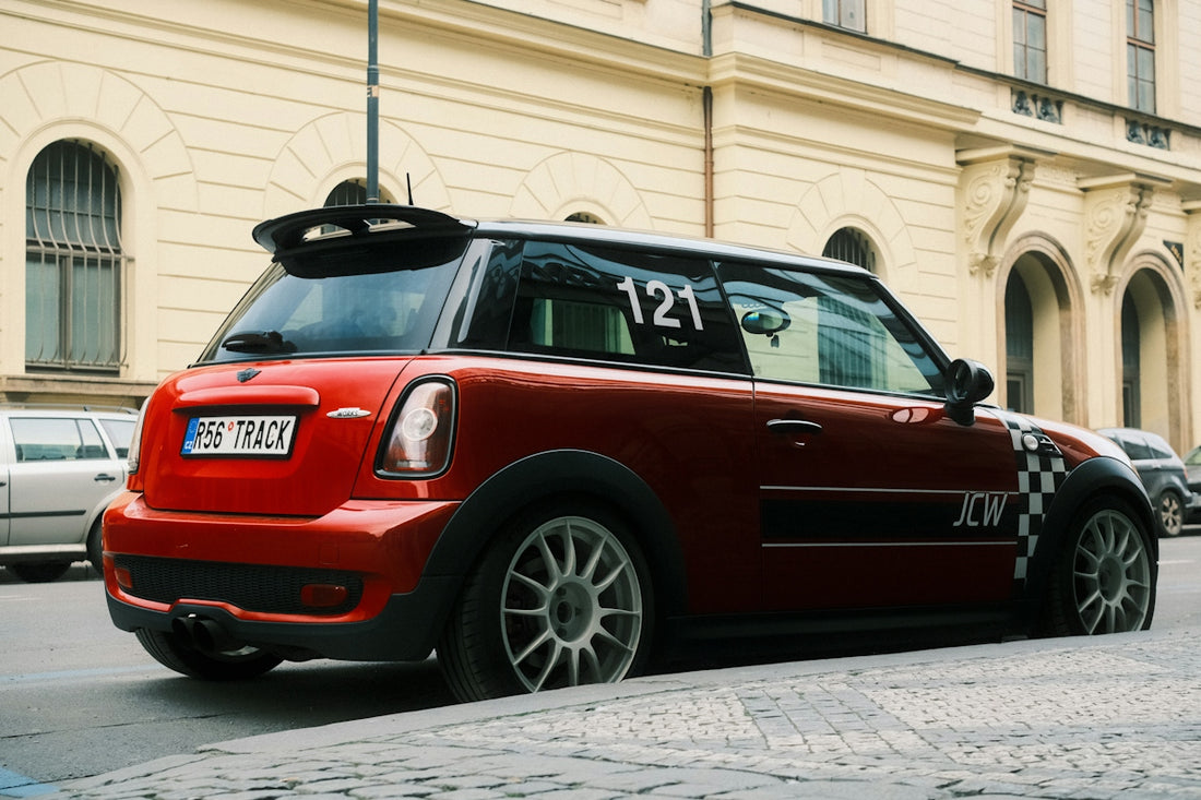 Red mini cooper parked on a city street