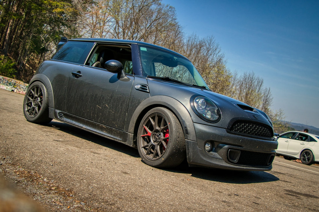A dark gray mini cooper s parked outdoors