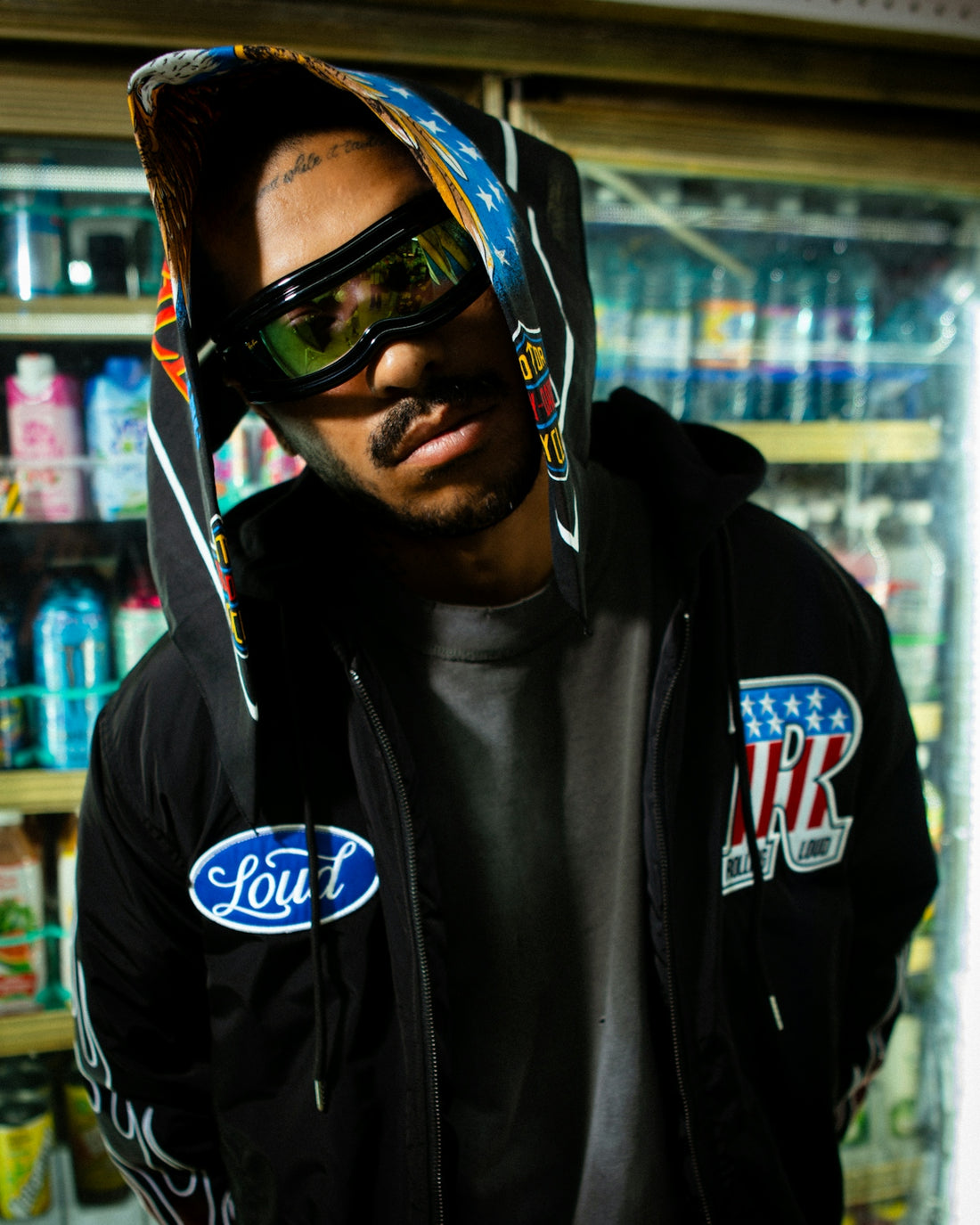 Man wearing goggles and a hooded jacket